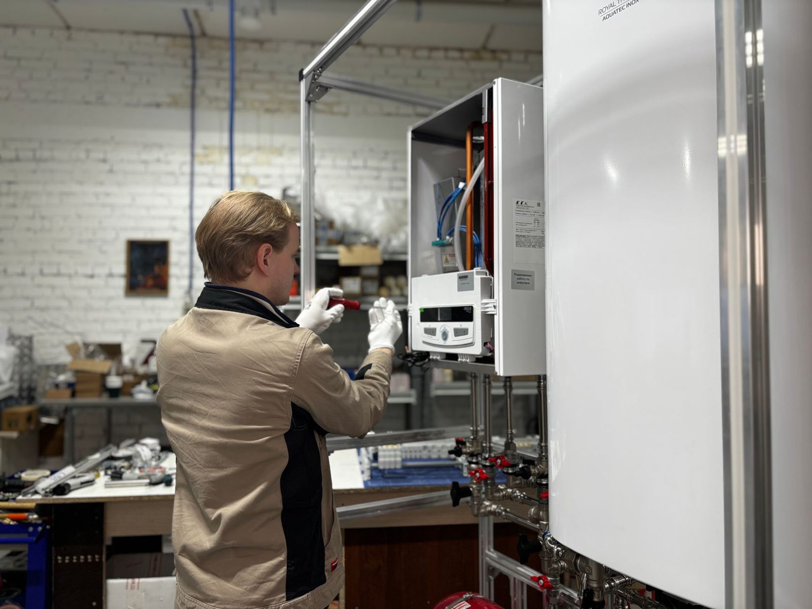 Engineer working on an open boiler