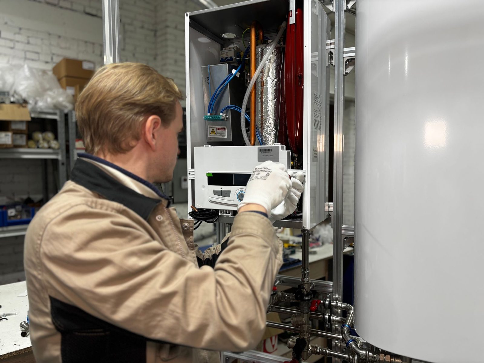 Engineer repairing a boiler