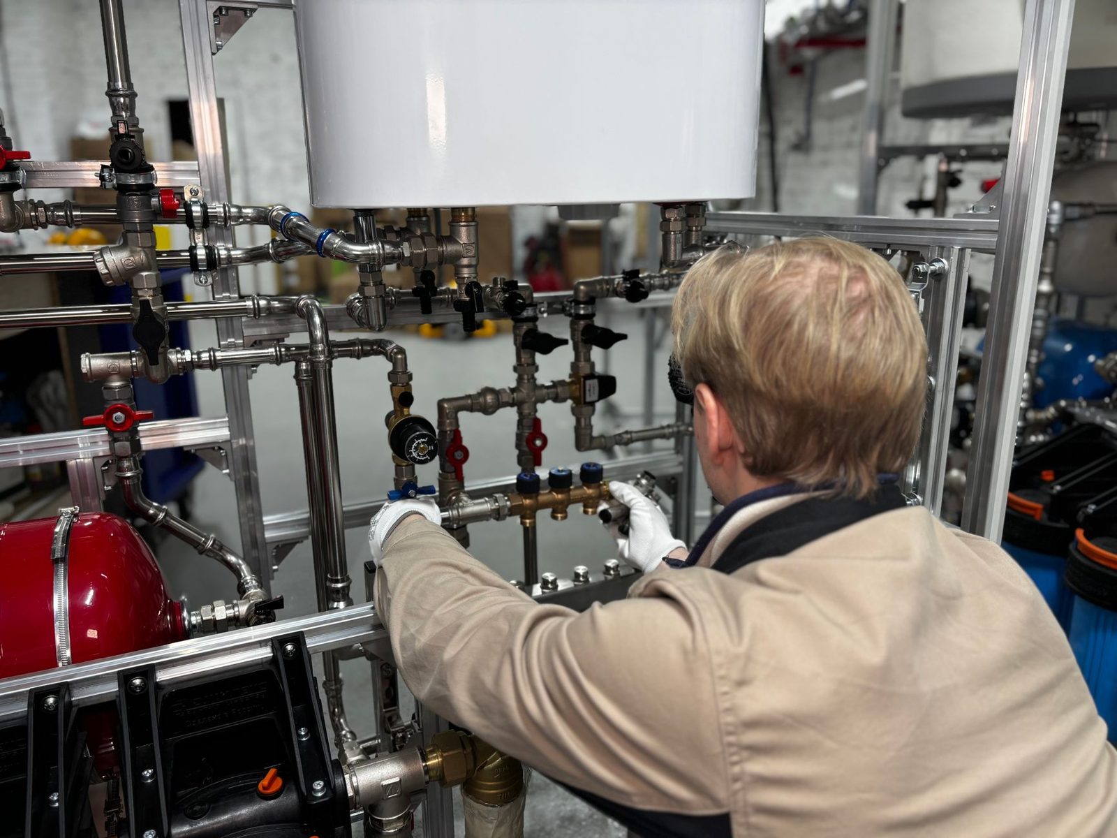 Engineer checking heating pipework